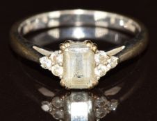 A 9ct gold ring set with an aquamarine and diamonds, 2.2g, size K