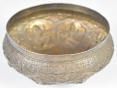 Indian, Burmese or similar silver bowl with embossed decoration of deities, diameter 12.5cm,