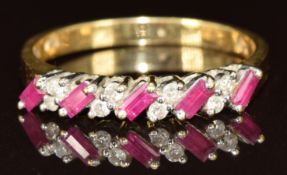 An 18ct gold ring set with five baguette cut rubies and eight round cut diamonds, 2.9g, size N