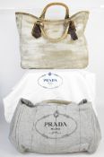 Two Prada bags, one appears almost unused