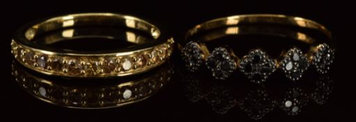 Two 9ct gold rings, one a half eternity ring set with diamonds and the other black diamonds, 4.1g,