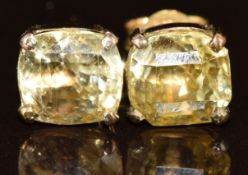 A pair of 9ct gold earrings each set with a mixed cut yellow sapphire of approximately 2ct, 2.2g