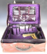 Edward VII or George V cased gentleman's travelling case, the purple leather case opening to