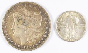 1917 United States of America standing Liberty quarter dollar and an 1880 Morgan one dollar, both