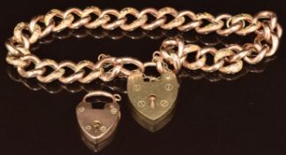 A 9ct rose gold curb link bracelet with alternating engraved links, with more modern 9ct heart