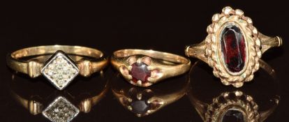 Three 9ct gold rings, two set with garnets and one with diamonds, 5.8g, size P & G