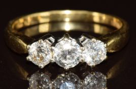 An 18ct gold ring set with three diamonds of approximately 0.38ct, 0.25ct & 0.25ct, 3.6g, size Q