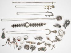 A collection of silver jewellery set with marcasite including eight brooches, four pairs of