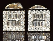 A pair of 18ct white gold earrings set with baguette and round cut diamonds, 3.4g
