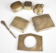 Hallmarked silver items comprising two cigarette cases (weight 171g), travelling inkwell, mustard