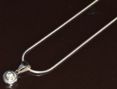 A 9ct white gold pendant set with a diamond of approximately 0.2ct, on 9ct white gold snake chain,