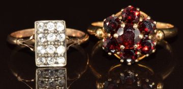 Two 9ct gold rings, one set with garnets in a cluster and the other white sapphires in a rectangular