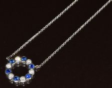 An 18ct white gold necklace set with diamonds and sapphires in a circular setting by Soley, 4g,
