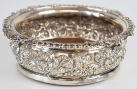 Georgian hallmarked silver wine bottle coaster with embossed decoration, Sheffield 1823, maker