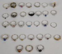 Thirty one silver rings including ruby, labradorite, diamond, quartz, garnet, tanzanite, etc, 85g