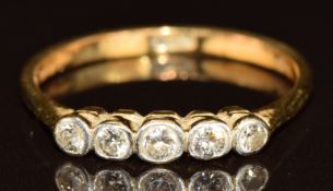 A c1920 18ct gold ring set with five diamonds, 2.1g, size O