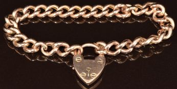 A 9ct rose gold curb link bracelet with heart padlock clasp, 11.7g, 16.5cm