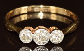 An 18ct gold ring set with three diamonds in a platinum setting, in original H. Samuel box, 2g, size