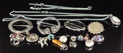 A collection of silver jewellery including two Scottish pins, stick pin in the form of a crop and