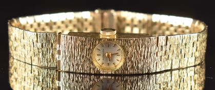 Bueche Girod 9ct gold ladies wristwatch with gold hands and hour markers, silver dial and signed