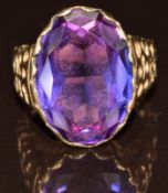A 9ct gold ring set with an oval cut amethyst, 7g, size N