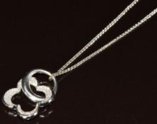 An 18ct white gold pendant in the form of a flower set with diamonds (2.5 x 2cm, total diamond