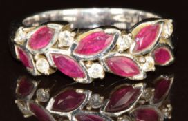 An 18ct white gold ring set with marquise cut rubies and diamonds, 6g, size O
