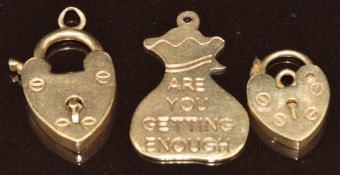Two 9ct gold heart padlock clasps and a 9ct gold pendant / charm in the form of a money bag engraved