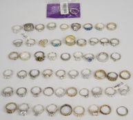 Fifty two silver rings including cubic zirconia, Greek key, etc