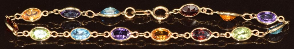 A 9ct gold bracelet set with topaz, amethyst, citrines, peridot and garnets, 2.6g, 17.5cm