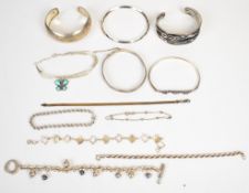 Five silver bangles including amethyst and seven silver bracelets including rope twist, ribbon, etc,