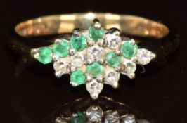 A 9ct gold ring set with emeralds and diamonds, 2.1g, size K