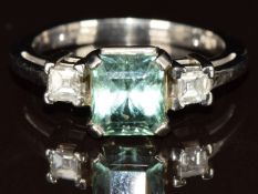 A 14k white gold ring set with an emerald mixed cut parabia tourmaline of approximately 1.7ct and