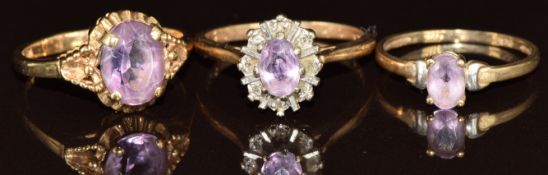 Three 9ct gold rings set with amethyst, 5.7g, size L, M & J