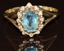 A 9ct gold ring set with topaz surrounded by diamonds, 2.1g, size N