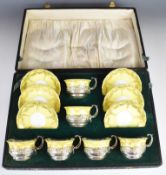 Cased George V hallmarked silver mounted Crown Staffordshire tea set comprising six tea cups and