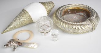 A silver teether and rattle in the form of a spaniel, silver mounted bottle, white metal anklet