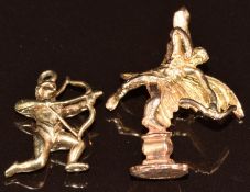 Two 9ct gold pendants/ charms in the form of Eros, 6.5g