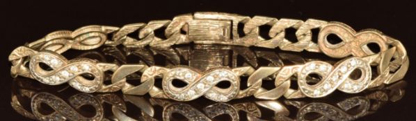 A 9ct gold bracelet made up of curb and figure of eight links, the figure of eight links set with