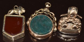 A 9ct gold swivel fob set with carnelain agate and bloodstone and two fobs one with a lion to the