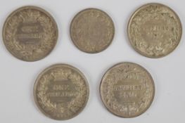 Four Victorian shillings comprising 1861, 1864, 1872 and 1879 and an 1883 sixpence