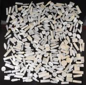 Approximately three hundred 19thC Chinese carved and engraved mother of pearl gaming tokens, largest