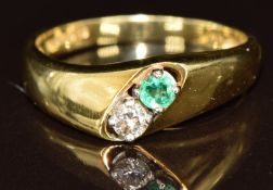 An 18ct gold ring set with a round cut diamond and emeralds. each approximately 0.1ct, 4.1g, size P