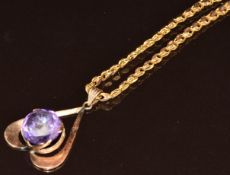 A 14ct gold chain made up of marquise shaped links and a 14k gold pendant set with a synthetic