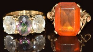 Two 9ct gold rings, one set with treated topaz and white topaz and the other paste, 10.5g, size
