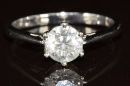 An 18ct white gold ring set with a round brilliant cut diamond of approximately 1.1ct, 4.2g, size S