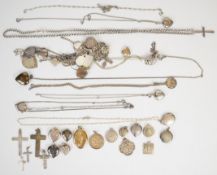 A collection of silver jewellery including fifteen heart lockets, six other lockets, five St