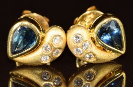 A pair of 18k gold earrings each set with a pear cut sapphire of approximately 0.4ct and diamonds,