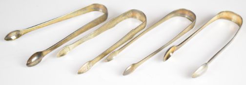 Four pairs of Georgian hallmarked silver sugar nips or tongs, two with bright cut decoration,