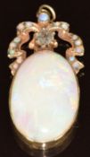 An 18ct gold pendant set with an old cut diamond of approximately 0.25ct and opals, 5.5g, 3.6cm